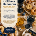 Table décorée pour Hanoukka avec des beignets colorés et des guirlandes lumineuses.